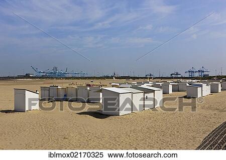 Stock Photography - Beach chairs and cranes on the beach of Zeebrugge, West Flanders, Flemish Region, Belgium, Europe. Fotosearch
