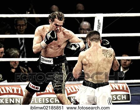 Boxing evening, European Middleweight Championship title match, Dominik Britsch, Germany, black pants, vs. Roberto Santos, Spain, white shorts, Porsche Arena, Stuttgart, Baden-Wuerttemberg, Germany, Europe View Large Photo Image Stock Image - Boxing evening, European Middleweight Championship title match, Dominik Britsch, Germany, black pants, vs. Roberto Santos, Spain, white shorts, Porsche Arena, Stuttgart, Baden-Wuerttemberg, Germany, Europe. Fotosearch