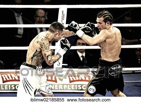 Boxing evening, European Middleweight Championship title match, Dominik Britsch, Germany, black pants, vs. Roberto Santos, Spain, white shorts, Porsche Arena, Stuttgart, Baden-Wuerttemberg, Germany, Europe View Large Photo Image Stock Photography - Boxing evening, European Middleweight Championship title match, Dominik Britsch, Germany, black pants, vs. Roberto Santos, Spain, white shorts, Porsche Arena, Stuttgart, Baden-Wuerttemberg, Germany, Europe. Fotosearch