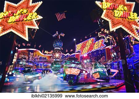 Stock Photo - Break Dancer carousel at night, Oktoberfest, Munich, Bavaria, Germany, Europe. Fotosearch