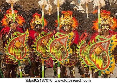 Stock Image - Brightly painted warriors of the Tribu Lunok folk group at the Pasinaya 2012 Folk Festival at the Cultural Centre of the Philippines, Manila, Philippines, Asia. Fotosearch