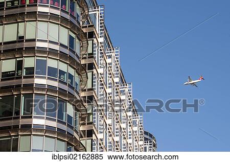 British Aerospace Avro RJ100 Airliner and office building at 20 Canada Square, designed by Adrian D. Smith of Skidmore, Owings and Merrill architects, Canary Wharf, Docklands, London, England, United Kingdom, Europe View Large Photo Image Stock Photography - British Aerospace Avro RJ100 Airliner and office building at 20 Canada Square, designed by Adrian D. Smith of Skidmore, Owings and Merrill architects, Canary Wharf, Docklands, London, England, United Kingdom, Europe. Fotosearch