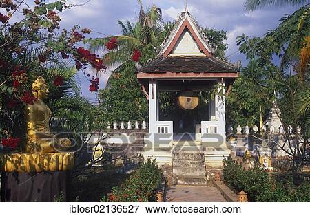 Stock Photo - Buddha statue and drum tower, Wat Choumkhong Sourintharame Temple, Luang Prabang, UNESCO World Heritage Site, Laos, Indochina, Asia. Fotosearch