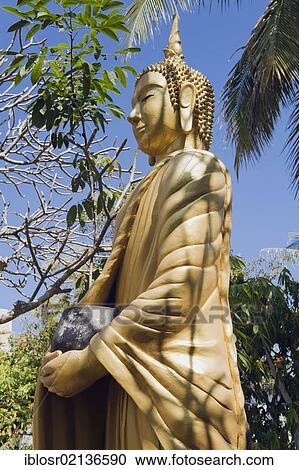 Buddha statue holding a begging bowl, Luang Prabang, UNESCO World Heritage Site, Laos, Indochina, Asia View Large Photo Image Stock Image - Buddha statue holding a begging bowl, Luang Prabang, UNESCO World Heritage Site, Laos, Indochina, Asia. Fotosearch