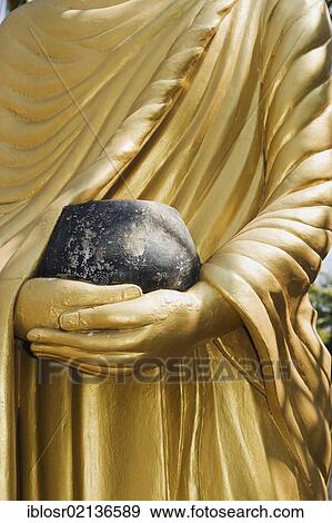 Buddha statue holding a begging bowl, Luang Prabang, UNESCO World Heritage Site, Laos, Indochina, Asia View Large Photo Image Stock Photo - Buddha statue holding a begging bowl, Luang Prabang, UNESCO World Heritage Site, Laos, Indochina, Asia. Fotosearch