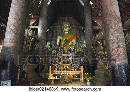 Buddha statue in the Sim, Wat Xieng Thong temple, Luang Prabang, Laos, Indochina, Asia View Large Photo Image Stock Photo - Buddha statue in the Sim, Wat Xieng Thong temple, Luang Prabang, Laos, Indochina, Asia. Fotosearch