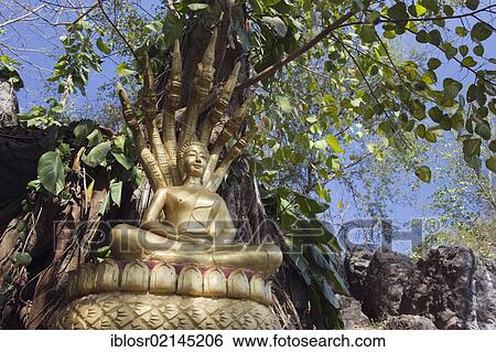 Stock Photograph - Buddha statue on Phousi Mountain, Luang Prabang, Laos, Indochina, Asia. Fotosearch
