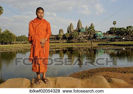Buddhist monk in front of the Angkor Wat temple complex, with reflection in the water, Siam Reap, Cambodia, Southeast Asia, Asia View Large Photo Image Stock Photo - Buddhist monk in front of the Angkor Wat temple complex, with reflection in the water, Siam Reap, Cambodia, Southeast Asia, Asia. Fotosearch