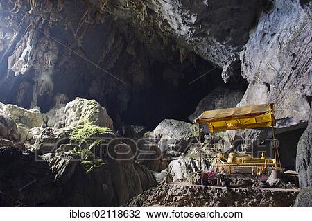 Buddhist shrine in the Tham Poukham Cave, stalactite or limestone cave in karst rock formations, Vang Vieng, Vientiane, Laos, Indochina, Asia View Large Photo Image Stock Image - Buddhist shrine in the Tham Poukham Cave, stalactite or limestone cave in karst rock formations, Vang Vieng, Vientiane, Laos, Indochina, Asia. Fotosearch