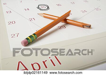 Calendar showing April 15th circled and a broken pencil, symbolic image for frustration with income taxes View Large Photo Image Stock Photo - Calendar showing April 15th circled and a broken pencil, symbolic image for frustration with income taxes. Fotosearch