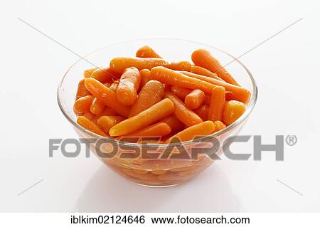 Stock Photograph - Canned carrots in glass bowl. Fotosearch