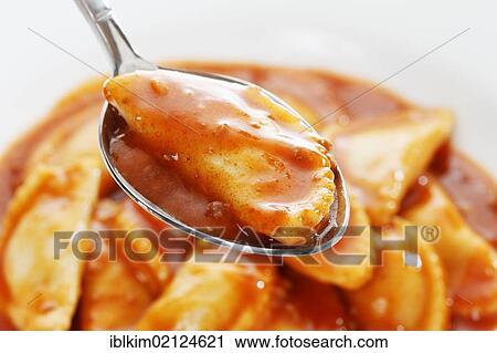 Canned ravioli on a white plate and spoon View Large Photo Image Stock Image - Canned ravioli on a white plate and spoon. Fotosearch