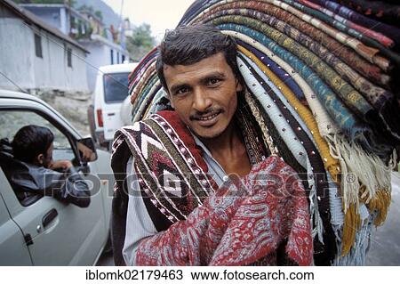 Stock Image - Carpet and cloth merchant or trader, Badrinath, Uttarakhand, formerly Uttaranchal, Indian Himalayas, North India, India, Asia. Fotosearch