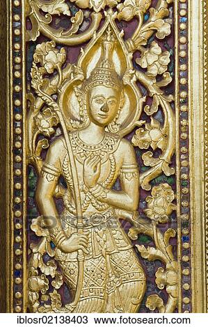 Stock Image - Carved entrance door to Wat Sene Temple, Wat Sensoukharam, Luang Prabang, UNESCO World Heritage Site, Laos, Indochina, Asia. Fotosearch