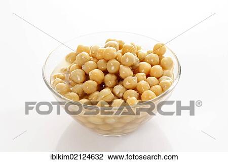 Stock Image - Chickpeas from a can in a glass bowl. Fotosearch