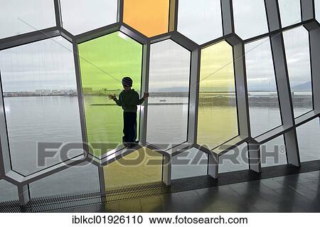 Child standing in one of the honeycomb-shaped windows in the facade, new Harpa concert hall in Reykjavik, Iceland, Europe View Large Photo Image Stock Image - Child standing in one of the honeycomb-shaped windows in the facade, new Harpa concert hall in Reykjavik, Iceland, Europe. Fotosearch