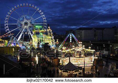 Stock Image - Christmas market and fairground with Ferris wheel at the Alexa Shopping Center, Alexanderplatz Square, Berlin-Mitte, Berlin, Germany, Europe. Fotosearch