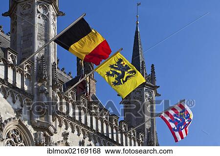 City hall with flags, Castle Square, old town of Bruges, UNESCO World Heritage Site, West Flanders, Flemish Region, Belgium, Europe View Large Photo Image Stock Photo - City hall with flags, Castle Square, old town of Bruges, UNESCO World Heritage Site, West Flanders, Flemish Region, Belgium, Europe. Fotosearch