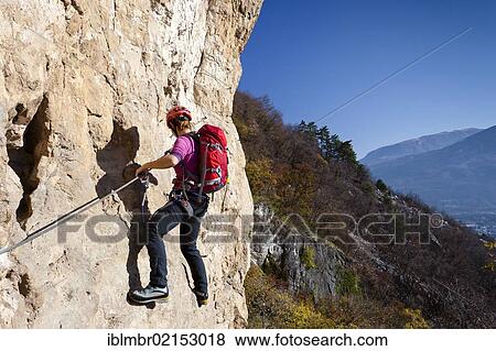 Climber ascending Monte Albano along the climbing route above Mori, Lake Garda hills, Rovereto, Trento, Italy, Europe View Large Photo Image Stock Photo - Climber ascending Monte Albano along the climbing route above Mori, Lake Garda hills, Rovereto, Trento, Italy, Europe. Fotosearch