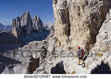 Climber ascending Paternkofel Mountain, looking towards the Three Peaks, Alta Pusteria, Sesto, Dolomites, Alto Adige, Italy, Europe View Large Photo Image Stock Photo - Climber ascending Paternkofel Mountain, looking towards the Three Peaks, Alta Pusteria, Sesto, Dolomites, Alto Adige, Italy, Europe. Fotosearch