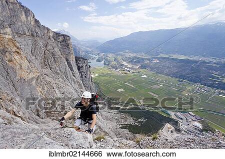 Climber climbing the Che Guevara climbing route on Monte Casale in Sarca Valley, Lake Garda area, overlooking Lake Toblino, Trento, Italy, Europe View Large Photo Image Stock Photograph - Climber climbing the Che Guevara climbing route on Monte Casale in Sarca Valley, Lake Garda area, overlooking Lake Toblino, Trento, Italy, Europe. Fotosearch