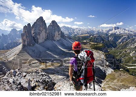Stock Image - Climber on Paternkofel Mountain, looking towards The Three Peaks, Monte Cristallo and Hohe Gaisl Mountain, Sesto, Alta Pusteria, Dolomites, Alto Adige, Italy, Europe. Fotosearch