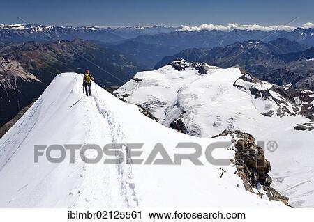 Climber on the summit of Piz Palue Mountain, Grisons, Switzerland, Europe View Large Photo Image Stock Image - Climber on the summit of Piz Palue Mountain, Grisons, Switzerland, Europe. Fotosearch