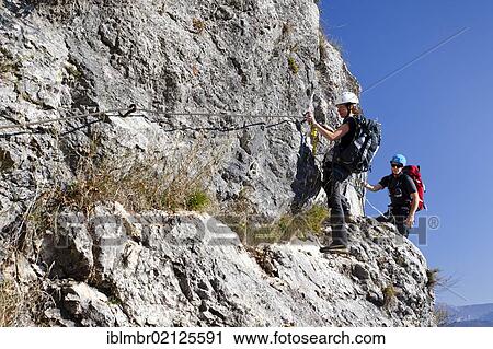 Climbers ascending Monte Albano along the fixed climbing route above Mori, Lake Garda Mountains, Rovereto, Trento, Italy, Europe View Large Photo Image Stock Image - Climbers ascending Monte Albano along the fixed climbing route above Mori, Lake Garda Mountains, Rovereto, Trento, Italy, Europe. Fotosearch