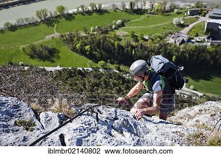 Climbers ascending on the Emperor Max climbing trail wall at the Martinswand rock face near Innsbruck, North Tyrol, Tyrol, Austria, Europe View Large Photo Image Stock Image - Climbers ascending on the Emperor Max climbing trail wall at the Martinswand rock face near Innsbruck, North Tyrol, Tyrol, Austria, Europe. Fotosearch