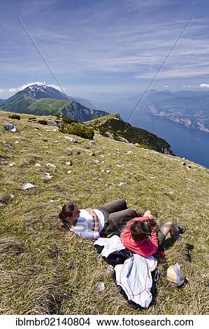 Picture - Climbers resting on Monte Altissimo above Nago, below Lake Garda, behind the Monte Baldo, Trentino, Italy, Europe. Fotosearch