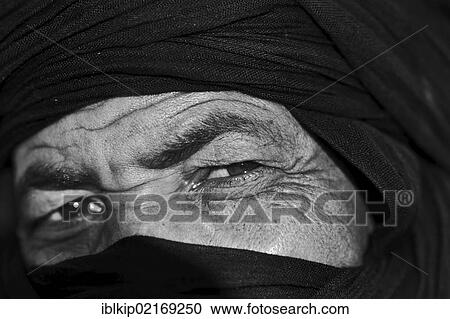 Stock Image - Close-up of face, man wearing the traditional tagelmust, Marrakesh, Morocco, Africa. Fotosearch