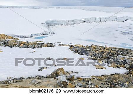 Coloured rock structures, hiker at Mittivakkat Glacier, Peninsula Ammassalik, East Greenland, Greenland, North America View Large Photo Image Stock Photo - Coloured rock structures, hiker at Mittivakkat Glacier, Peninsula Ammassalik, East Greenland, Greenland, North America. Fotosearch