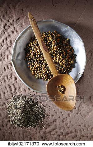 Colourful peppercorns (Piper nigrum) on a metal plate with a wooden spoon and coarsely ground pepper on a rustic stone base View Large Photo Image Stock Image - Colourful peppercorns (Piper nigrum) on a metal plate with a wooden spoon and coarsely ground pepper on a rustic stone base. Fotosearch