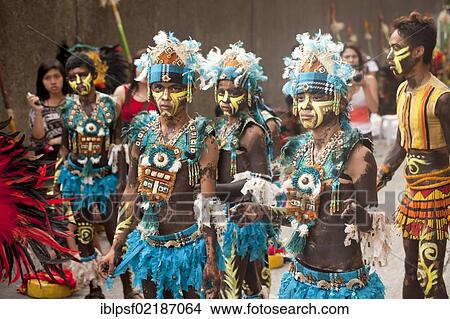 Colourfully painted actors in traditional costume at the Dinagyang Folk Festival in the Cultural Centre of the Philippines, Manila, Philippines, Asia View Large Photo Image Picture - Colourfully painted actors in traditional costume at the Dinagyang Folk Festival in the Cultural Centre of the Philippines, Manila, Philippines, Asia. Fotosearch