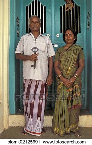 Couple, caretakers of an old villa with a large key in front of a green door, Chettinad, Tamil Nadu, South India, India, Asia View Large Photo Image Stock Image - Couple, caretakers of an old villa with a large key in front of a green door, Chettinad, Tamil Nadu, South India, India, Asia. Fotosearch