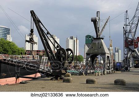 Cranes in Leuvehaven harbour, part of the Maritime Museum, Central Rotterdam, Holland, Nederland, the Netherlands, Europe View Large Photo Image Stock Photograph - Cranes in Leuvehaven harbour, part of the Maritime Museum, Central Rotterdam, Holland, Nederland, the Netherlands, Europe. Fotosearch