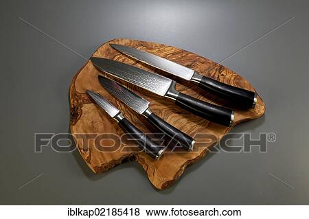 Damascus knives on olivewood board View Large Photo Image Stock Photo - Damascus knives on olivewood board. Fotosearch