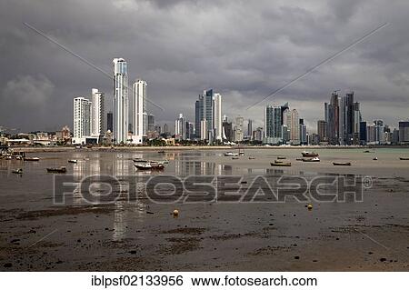 Stock Photograph - Dark storm clouds over the skyline of Panama City, Panama, Central America, North America. Fotosearch