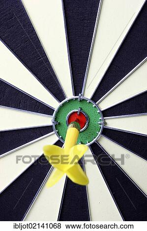 Darts, throwing game, dart sticking into the middle of the dartboard, the bullseye View Large Photo Image Stock Photo - Darts, throwing game, dart sticking into the middle of the dartboard, the bullseye. Fotosearch