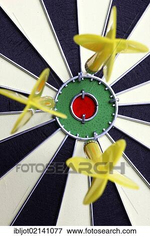 Darts, throwing game, darts narrowly off the middle of the dartboard, the bullseye View Large Photo Image Stock Photo - Darts, throwing game, darts narrowly off the middle of the dartboard, the bullseye. Fotosearch