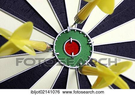 Darts, throwing game, darts narrowly off the middle of the dartboard, the bullseye View Large Photo Image Stock Photograph - Darts, throwing game, darts narrowly off the middle of the dartboard, the bullseye. Fotosearch