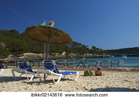 Deck chairs on the beach, Cala Mondrago, Majorca, Balearic Islands, Spain, Europe View Large Photo Image Stock Photograph - Deck chairs on the beach, Cala Mondrago, Majorca, Balearic Islands, Spain, Europe. Fotosearch