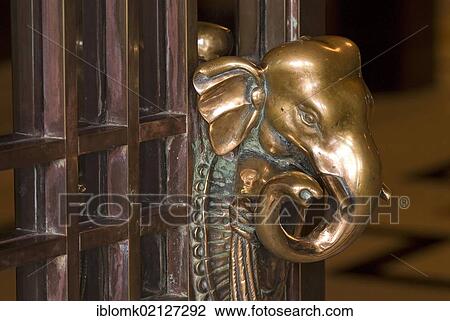 Stock Image - Door handle shaped like an elephant, Heritage Hotel, Taj Umaid Bhawan Palace Hotel, Jodhpur, Rajasthan, India, Asia. Fotosearch