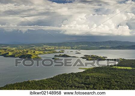 Dramatic clouds over Lake Sentani, Jayapura, West Papua, Western New Guinea, Indonesia, Asia View Large Photo Image Stock Photo - Dramatic clouds over Lake Sentani, Jayapura, West Papua, Western New Guinea, Indonesia, Asia. Fotosearch