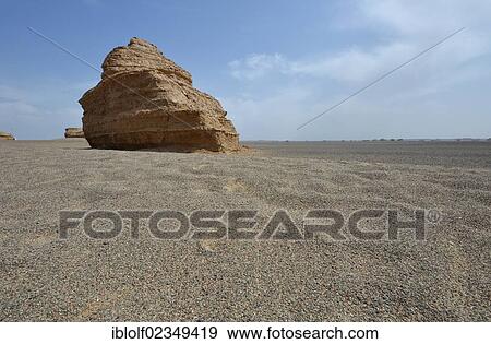 Stock Photo - Dry desert landscape with rock formations, historic Silk Road, Yumen Pass, Yadan National Park, Gansu, China, Asia. Fotosearch