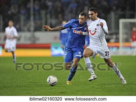 Stock Image - Duel, Daniel Williams, TSG 1899 Hoffenheim, left, vs. Mohammed Abdellaoue, Hannover 96, action, Wirsol Rhein-Neckar-Arena, Sinsheim-Hoffenheim, Baden-Wuerttemberg, Germany, Europe. Fotosearch