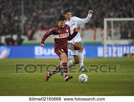 Stock Photo - Duel, William Kvist, VfB Stuttgart vs. Mario Gomez, FC Bayern Muenchen, right, action, Mercedes-Benz Arena, Stuttgart, Baden-Wuerttemberg, Germany, Europe. Fotosearch