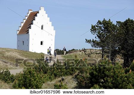 Dunes with the tower of the sand-engulfed Buried Church with cyclists, Skagen, Jutland, Denmark, Europe View Large Photo Image Stock Photograph - Dunes with the tower of the sand-engulfed Buried Church with cyclists, Skagen, Jutland, Denmark, Europe. Fotosearch