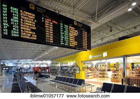 Duty-Free Shop and a departure board in the waiting area at a boarding gate, Fuerteventura Airport, Canary Islands, Germany, Europe View Large Photo Image Stock Photo - Duty-Free Shop and a departure board in the waiting area at a boarding gate, Fuerteventura Airport, Canary Islands, Germany, Europe. Fotosearch