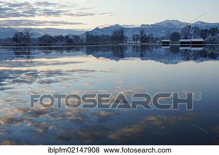 Early morning at lake Chiemsee, Chiemgau, Upper Bavaria, Germany, Europe View Large Photo Image Stock Photo - Early morning at lake Chiemsee, Chiemgau, Upper Bavaria, Germany, Europe. Fotosearch